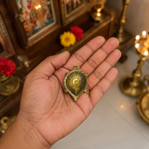 Compact Brass Turtle Diya shown in hand for size reference antique brass Vastu oil lamp