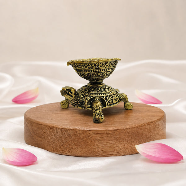 Side view of Brass Turtle Diya decorative antique brass Kurma oil lamp for spiritual decor