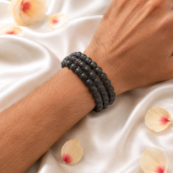 Original karungali kattai triple row ebony wood bracelet being worn on a person's wrist, showcasing its bold professional style.