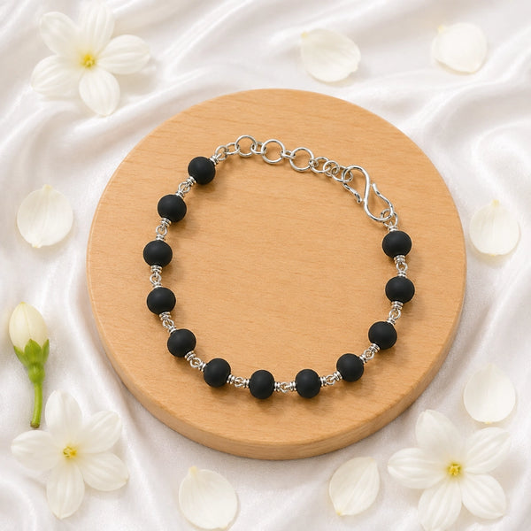 Premium Karungali ebony wood beads with artisanal silver wire loops, handcrafted for spiritual protection and style.
