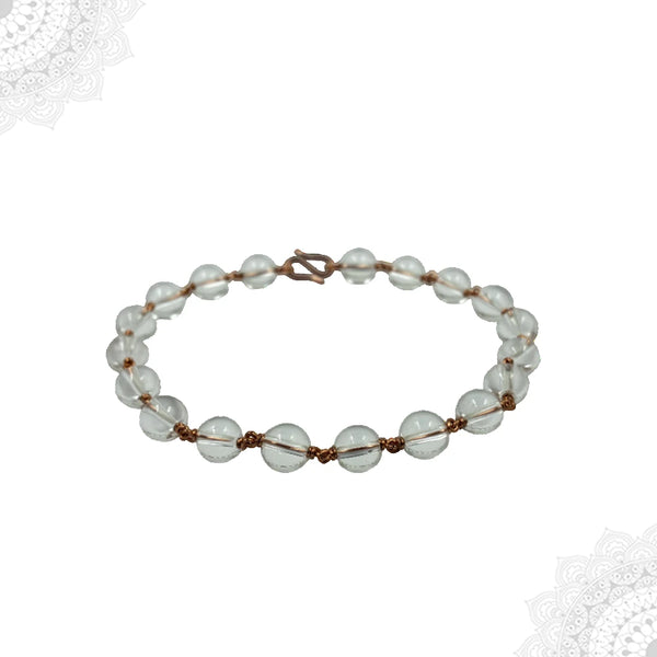 Detail view of genuine Clear Quartz Spadigam beads and artisanal copper wire wrapping.
