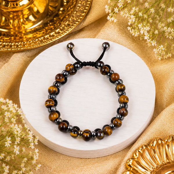 Side view of the double-row protective crystal bracelet on a white wooden display, highlighting the high-quality weaving and the adjustable slider knot.
