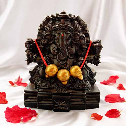 Karpaga Vinayagar fiber statue front view with golden beads and red mala