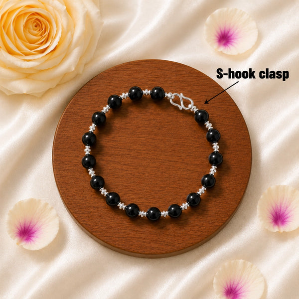 Original Karungali ebony wood bracelet featuring silver spacers and a traditional secure S-hook clasp for a premium spiritual look.