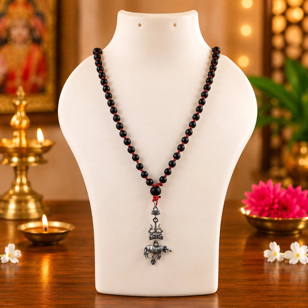 Devotional 71 plus 1 bead karungali kattai mala with a silver-finish Trishul Nandhi pendant displayed on a jewelry bust.