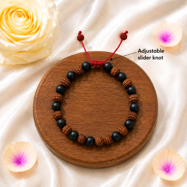 Top-down view of the Karungali and Rudraksha bead bracelet with a high-durability red adjustable cord