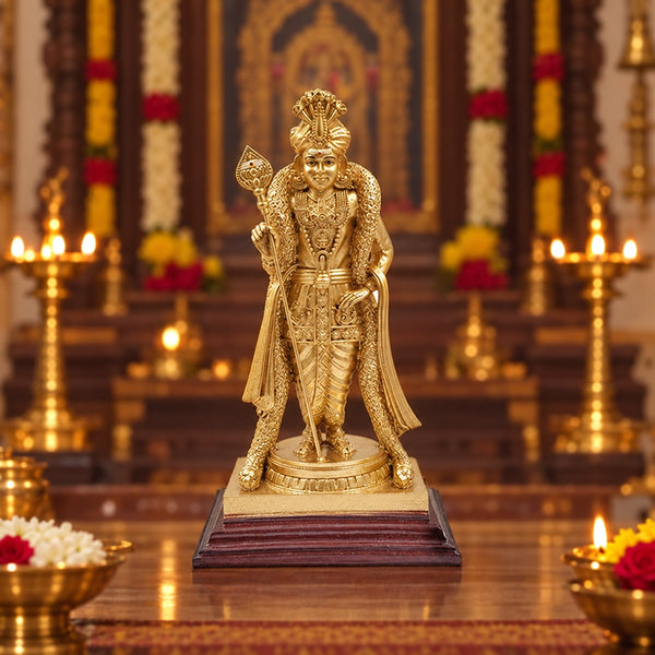 Lord Murugan statue holding the Vel, gold finish on wooden base