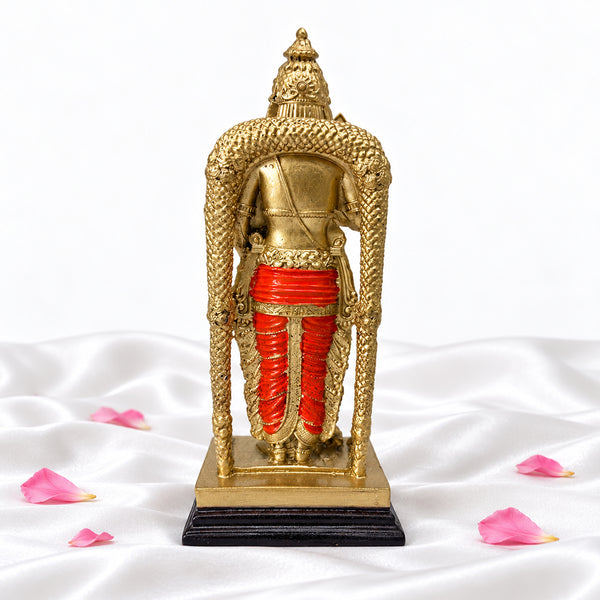 Back view of Murugan statue showing the crown, patterned arch and orange veshti