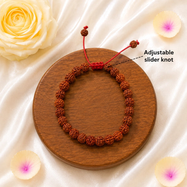 Original 5 Mukhi Rudraksha adjustable slider bracelet featuring a handcrafted red cord knot for a comfortable, custom fit