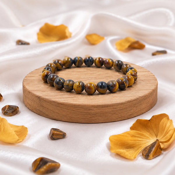 Premium Tiger's Eye crystal bracelet featuring chatoyant golden and blue gemstone beads for protection and confidence.