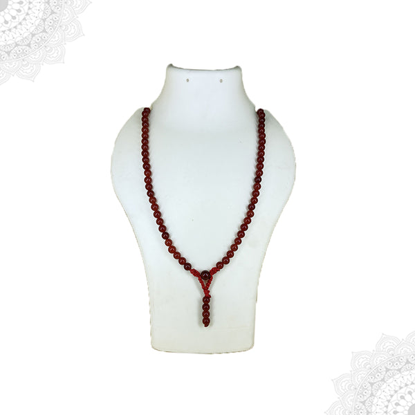 A long Red Carnelian crystal mala necklace with polished reddish-orange translucent beads displayed as a single strand on a white mannequin bust.