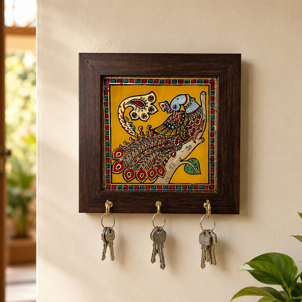 Tanjore art key hanger with peacock painting on yellow background