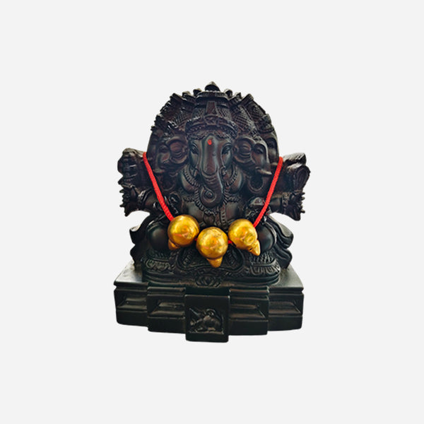 Three-headed Ganesha idol plain background studio shot