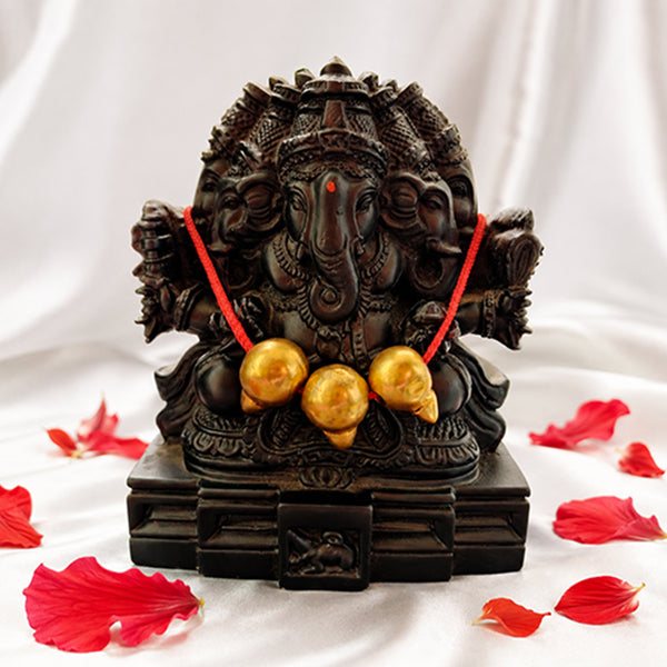 Trimukhi Ganesha black antique finish idol with red thread and modak balls