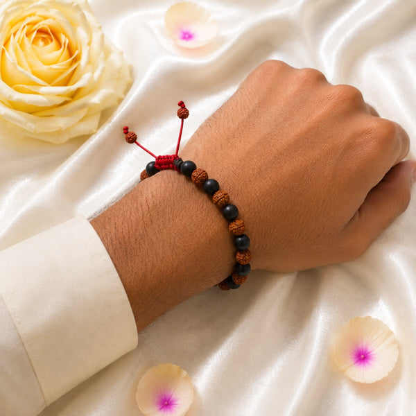 A person wearing the Karungali and Rudraksha combo bracelet, showcasing its fit and spiritual elegance for daily protection